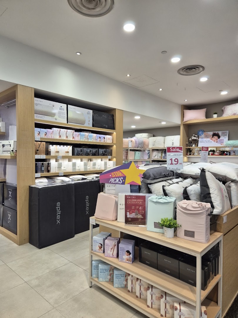 An interior view of Epitex, showcasing a wide range of bedding, pillows, and home comfort products.