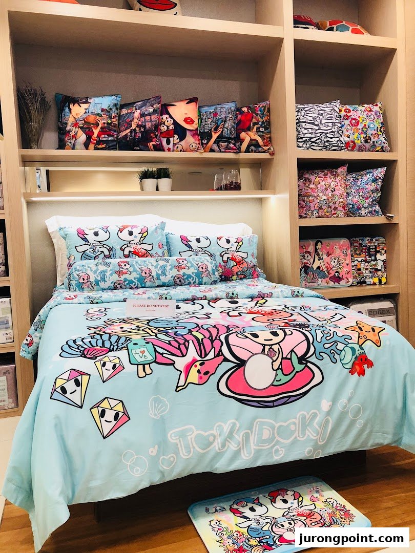 A vibrant Tokidoki-themed bed set with matching cushions displayed in a retail setting.