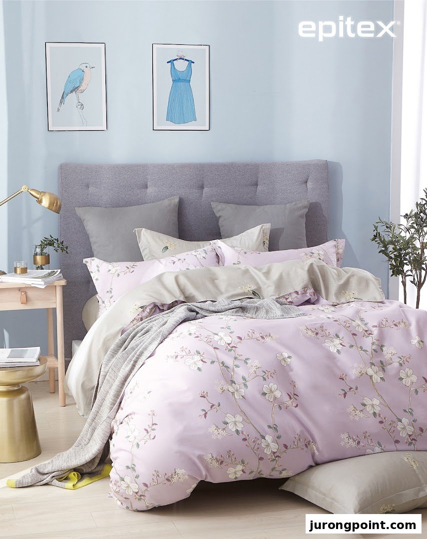 A beautifully styled bedroom featuring a bed with soft lavender floral bedding and decorative elements.