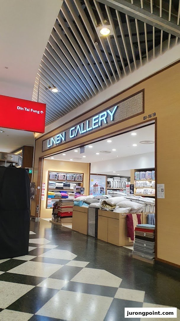 The storefront of Linen Gallery, showcasing a wide array of bedding and home textile products.