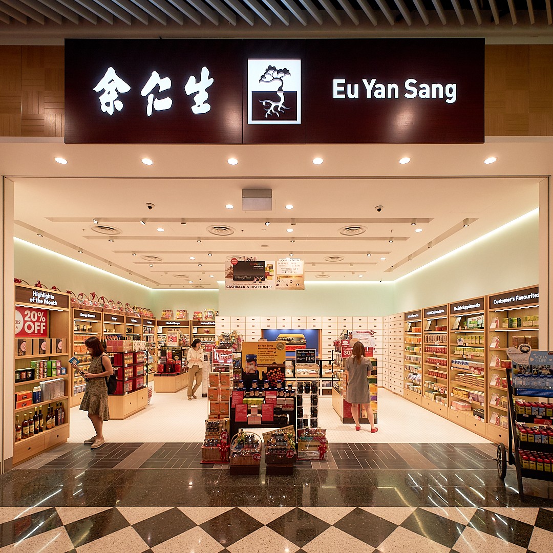 Interior view of Eu Yan Sang store with customers browsing health supplements and traditional Chinese medicine products.
