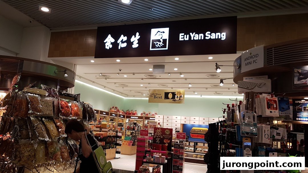 The entrance of Eu Yan Sang, a traditional Chinese medicine and health products store, with visible interior displays.