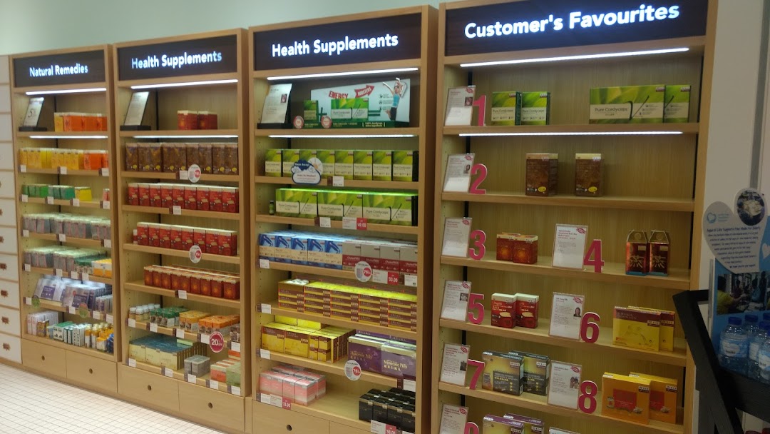 Interior view of Eu Yan Sang showcasing shelves filled with natural remedies and health supplements.