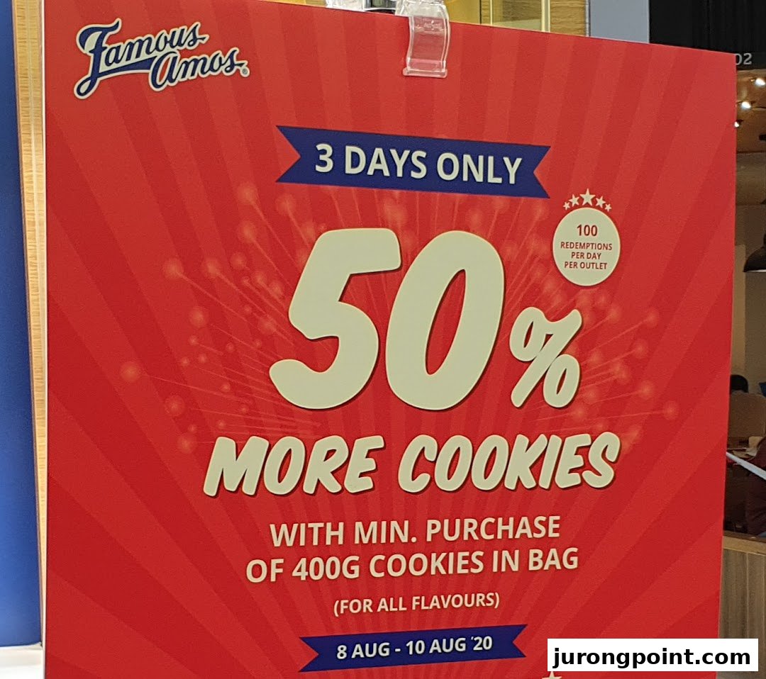 A vibrant red Famous Amos promotional poster advertising 50% more cookies with purchase for a limited time.