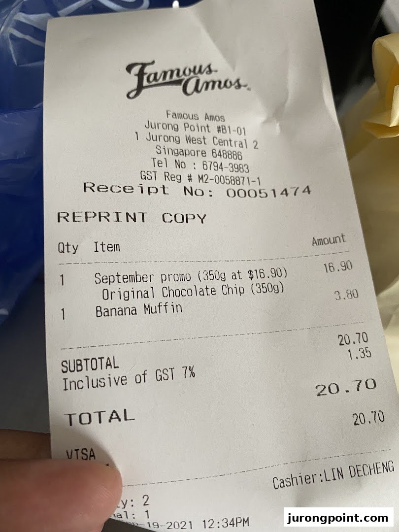 A close-up of a Famous Amos receipt detailing a purchase of cookies and a muffin.