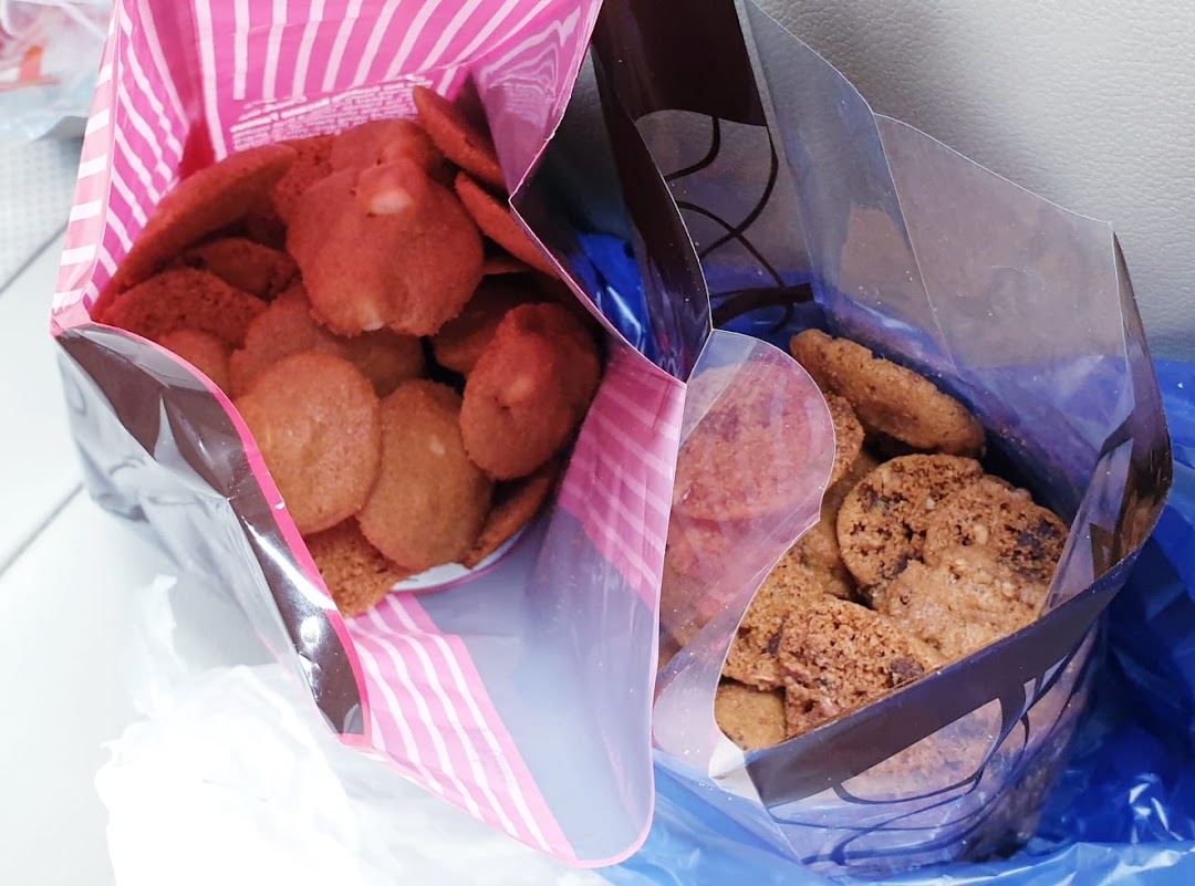 Two bags of delicious Famous Amos cookies, featuring different flavors.