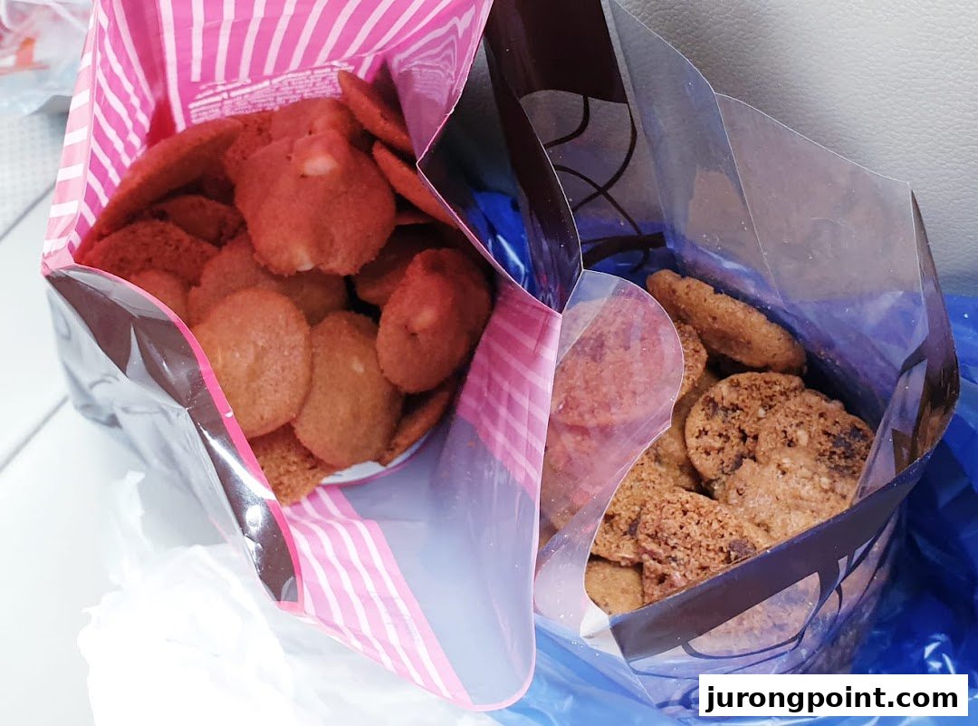 Two bags of delicious Famous Amos cookies, featuring different flavors.