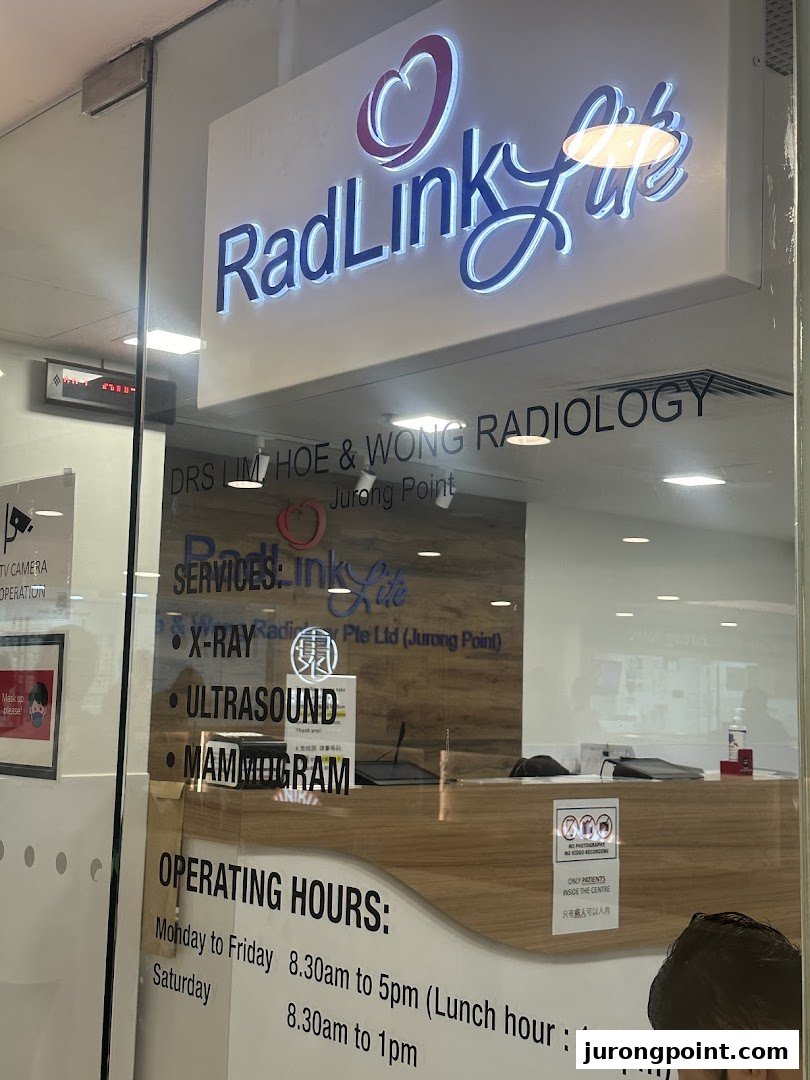 The entrance of RadLink Life radiology clinic, displaying services like X-ray, Ultrasound, and Mammogram, along with operating hours.