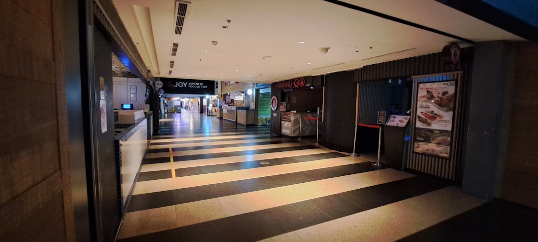 A mall corridor showcasing entrances to Yakiniku-GO and &JOY Japanese Food Street.