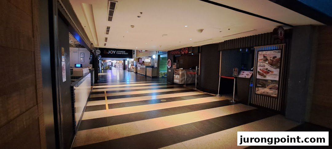 A mall corridor showcasing entrances to Yakiniku-GO and &JOY Japanese Food Street.