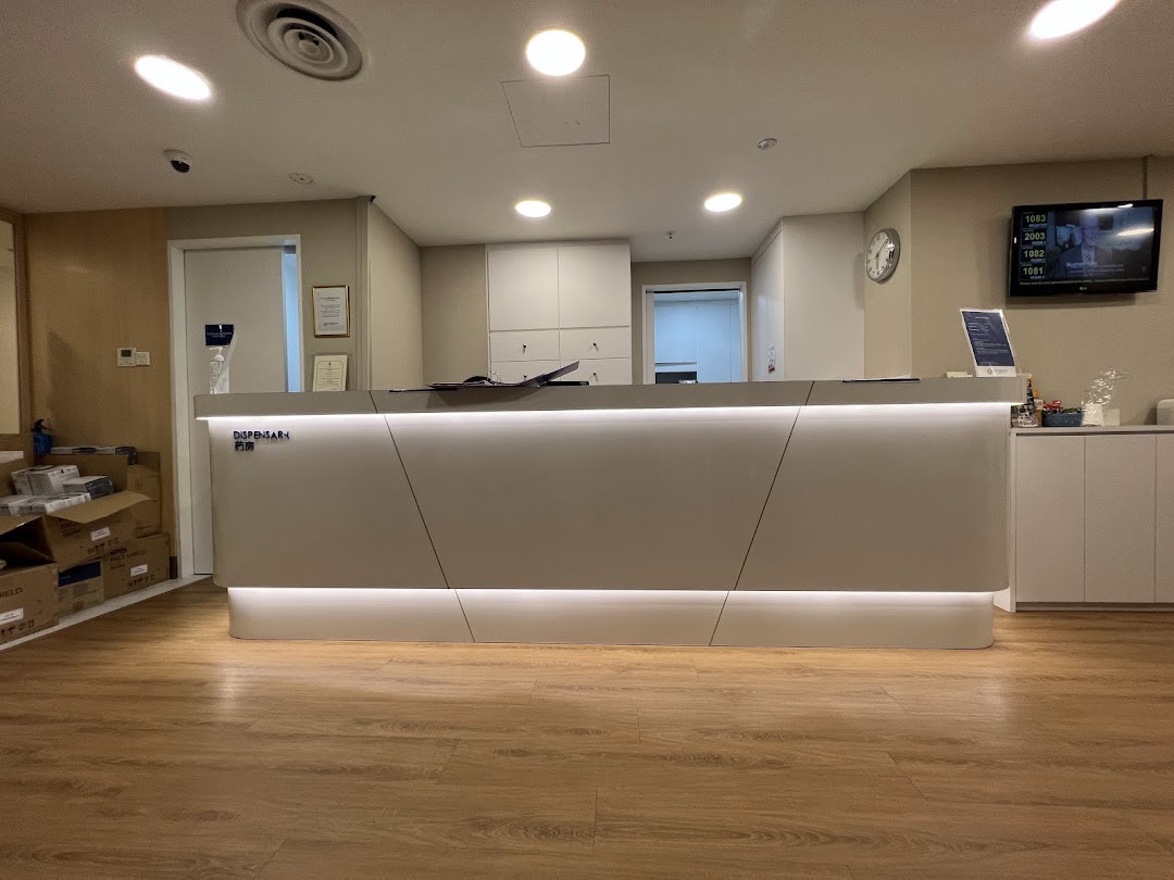 A clean, modern reception and dispensary area at Fullerton Health, featuring a well-lit counter.