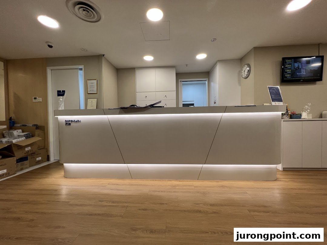 A clean, modern reception and dispensary area at Fullerton Health, featuring a well-lit counter.