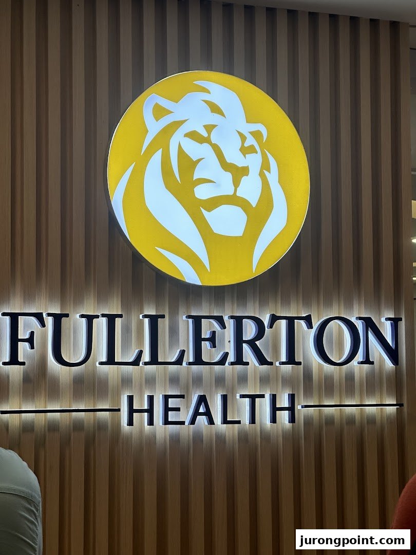 The illuminated sign for Fullerton Health featuring a prominent lion logo on a wooden slatted wall.