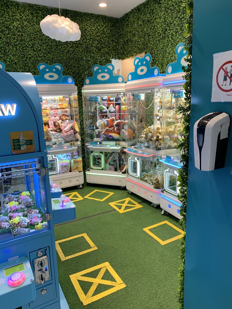 Interior view of Fun Claw, featuring multiple colorful claw machines with plush toys and prizes.