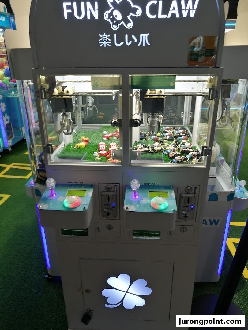 A Fun Claw arcade machine filled with various prizes, ready for play.