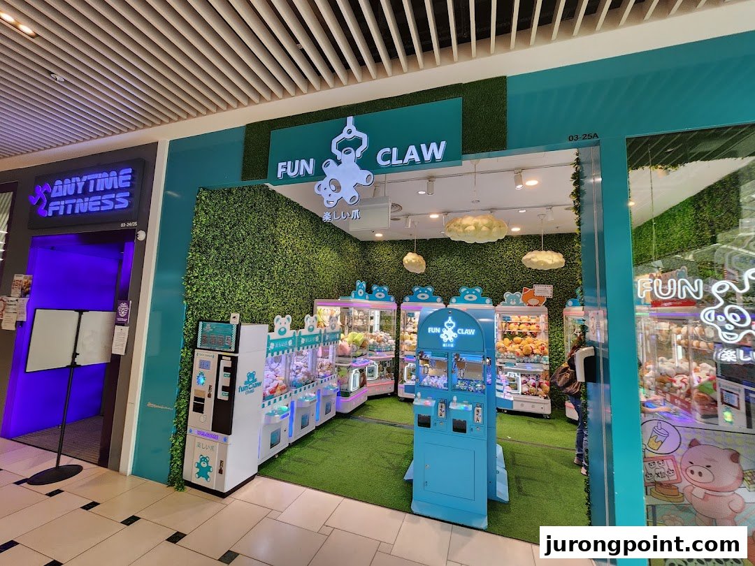 The vibrant entrance of Fun Claw, an arcade filled with numerous claw machines and plush toys.