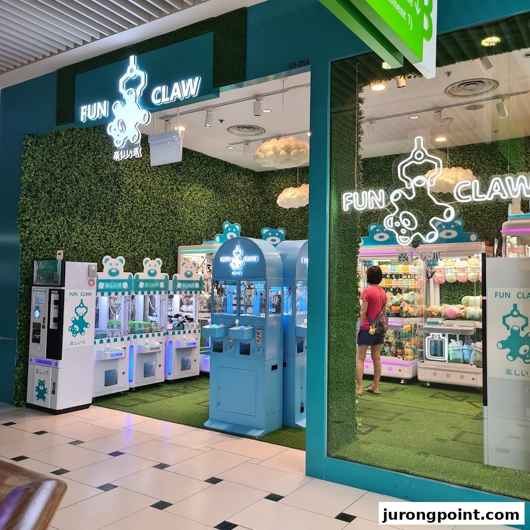 The vibrant green and blue exterior of the Fun Claw arcade, featuring claw machines and a customer inside.