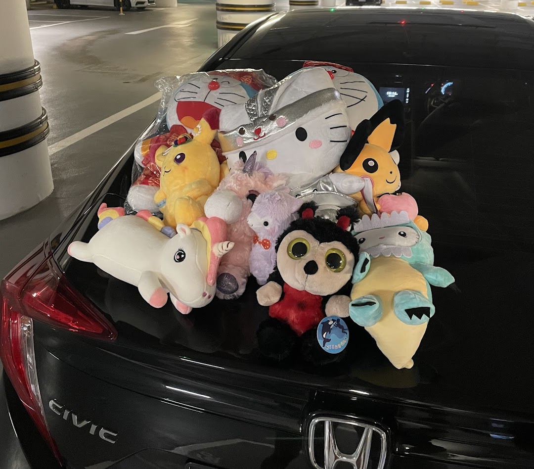 A car trunk filled with a variety of plush toys won from Fun Claw.