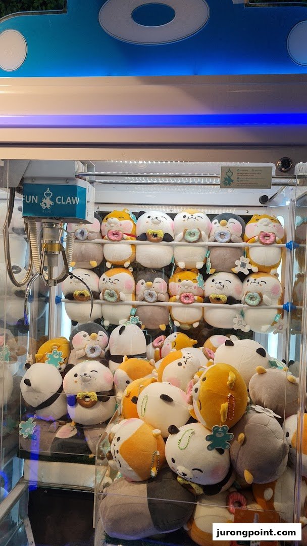 A claw machine filled with adorable, donut-holding plush toys from Fun Claw.