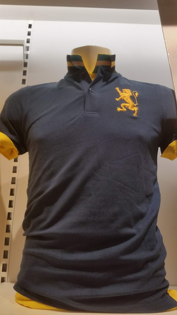 A dark blue polo shirt with a gold lion emblem and yellow accents displayed on a mannequin.
