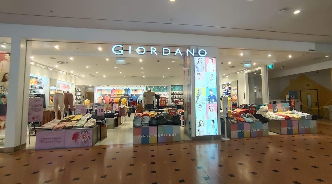 The Giordano shop front displays a wide range of colorful casual wear and promotional offers.
