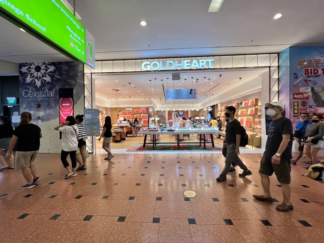 The brightly lit entrance of Goldheart Jewelry, showcasing its inviting interior and dazzling displays.