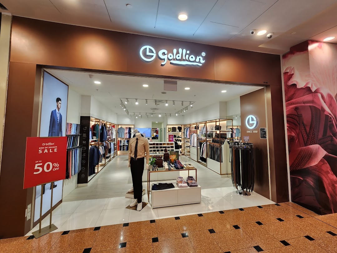 The Goldlion Apparel shop entrance showcasing menswear, accessories, and a prominent 50% off sale sign.