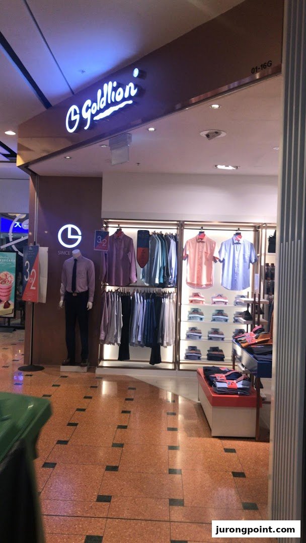 The Goldlion Apparel shop entrance features men's shirts, trousers, and accessories on display.