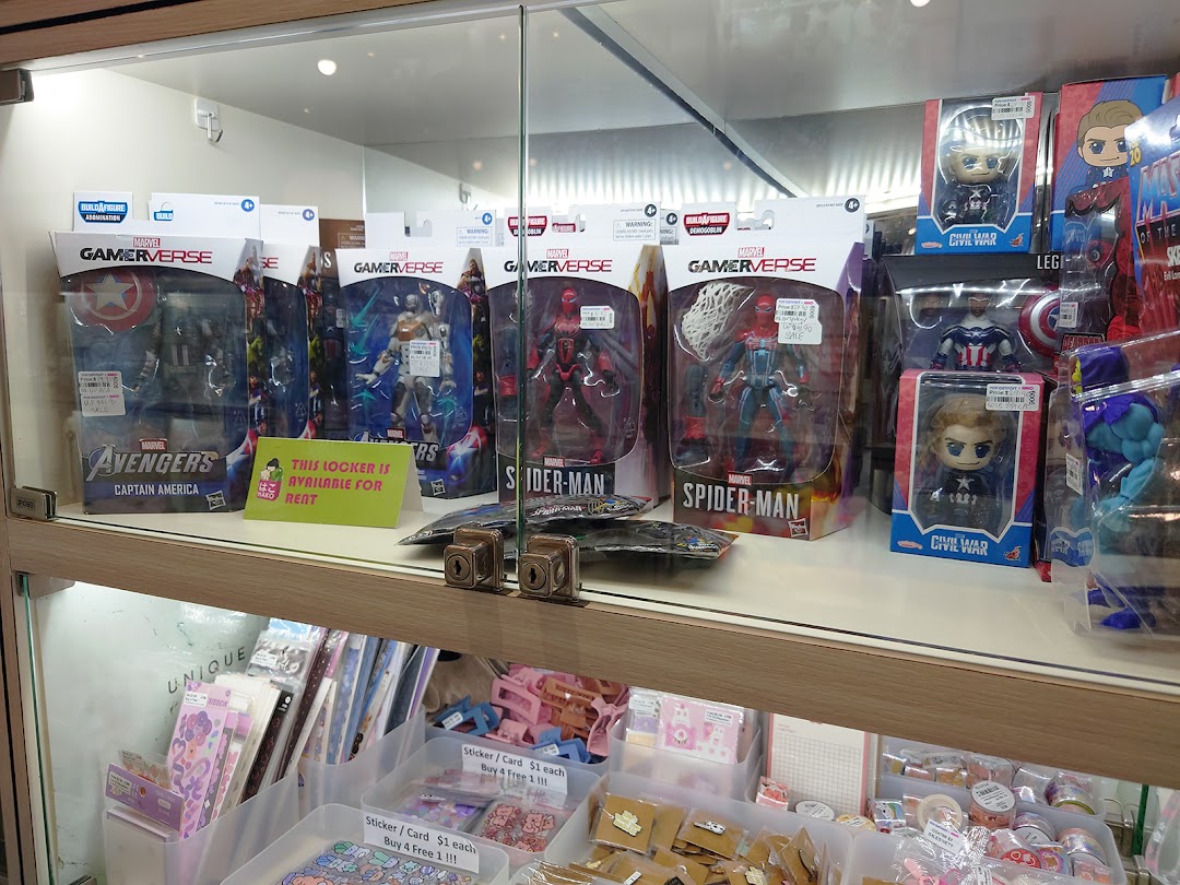 A display case showcasing Marvel action figures, collectibles, and various stationery items.