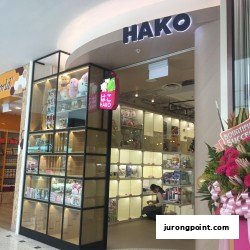 The Hako shop entrance features display cases with gifts and novelty items, inviting shoppers inside.