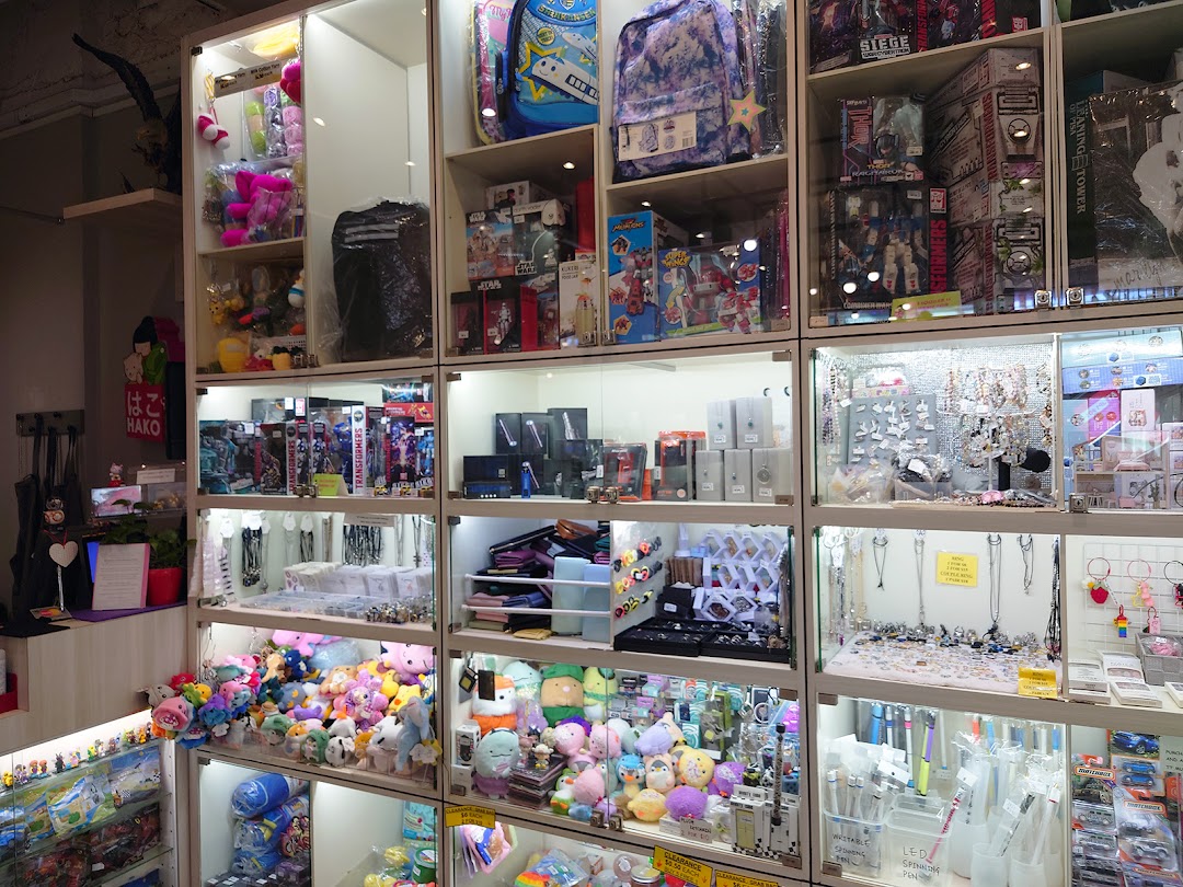 Brightly lit display shelves showcase a wide array of toys, plushies, accessories, and collectibles at Hako.