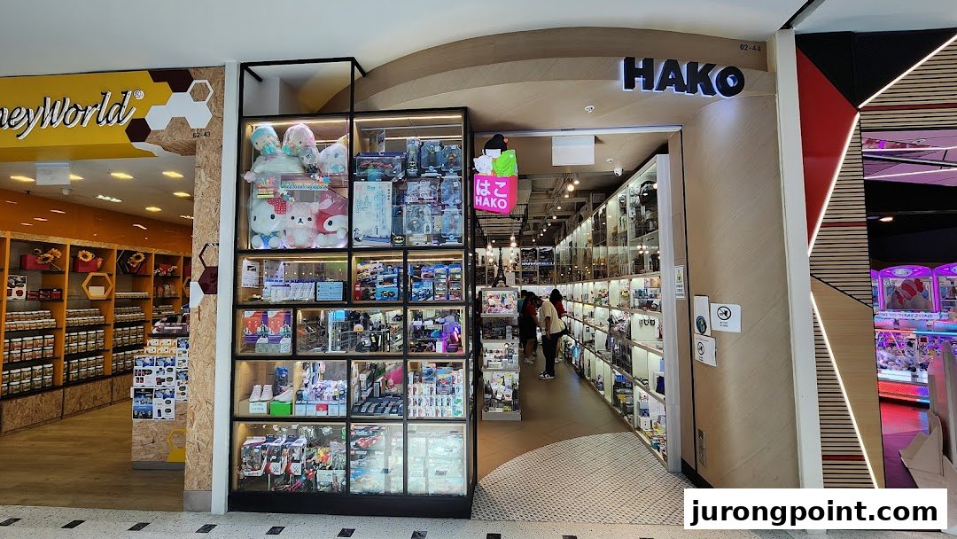 The entrance of Hako, a retail shop featuring extensive display cases filled with collectibles and unique items.