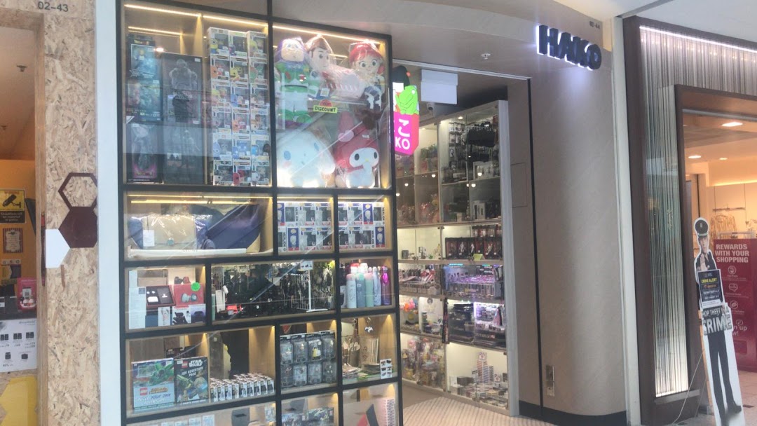 The Hako shopfront showcases a vibrant array of toys, collectibles, and unique merchandise in its display windows.
