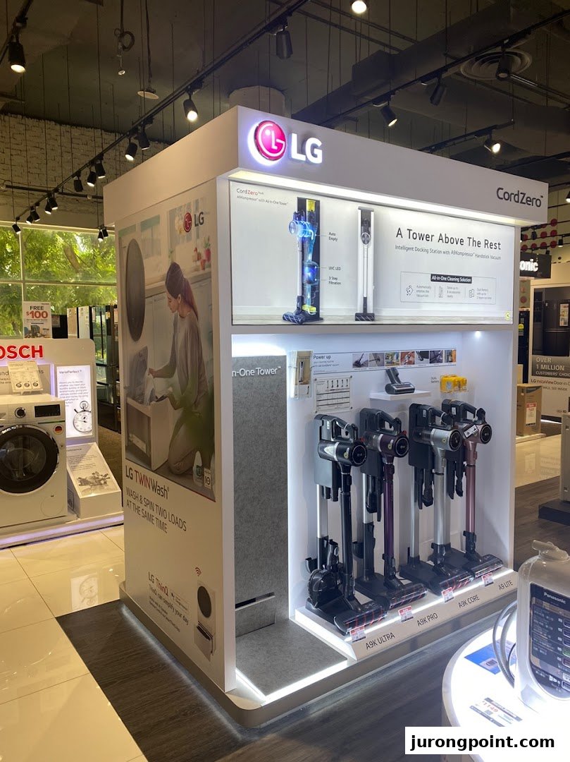 An LG display showcasing CordZero vacuum cleaners and a TwinWash washing machine at Harvey Norman.
