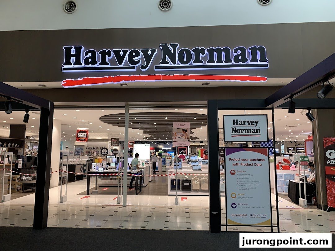 The brightly lit entrance of Harvey Norman, showcasing electronics and home appliances.