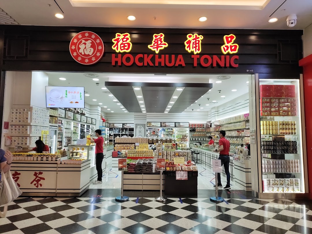 The shopfront of Hockhua Tonic, a traditional Chinese medicine and health products store, with staff inside.