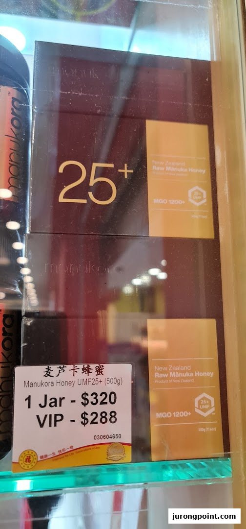 A display of premium Manukora UMF25+ Manuka Honey jars with pricing details at Hockhua Tonic.
