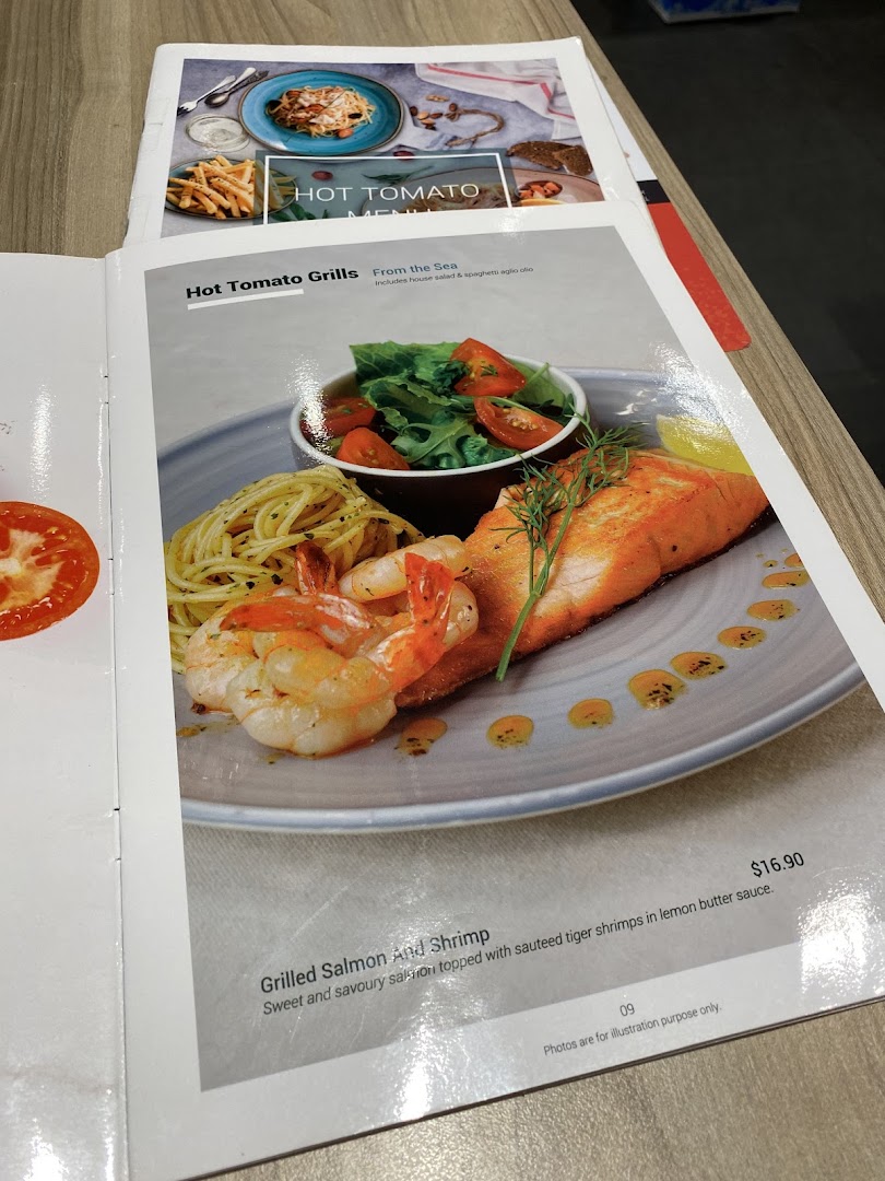 A page from the Hot Tomato menu featuring Grilled Salmon and Shrimp with spaghetti and salad.