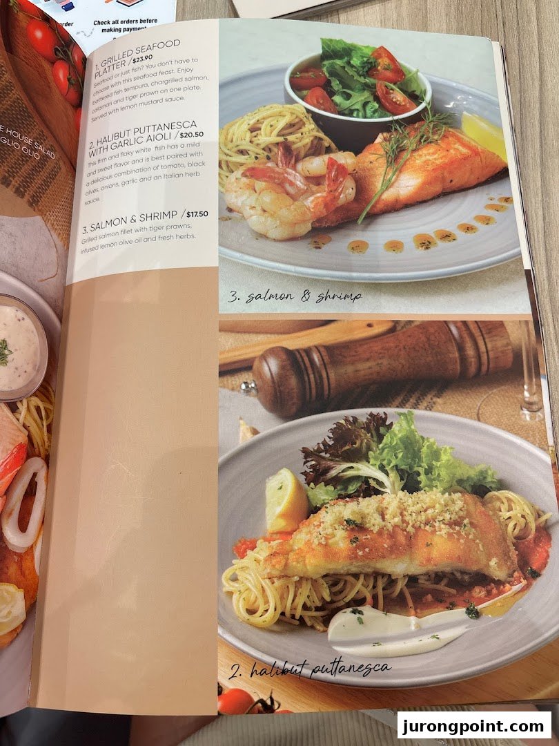 A page from Hot Tomato's menu featuring seafood and pasta dishes with prices and descriptions.