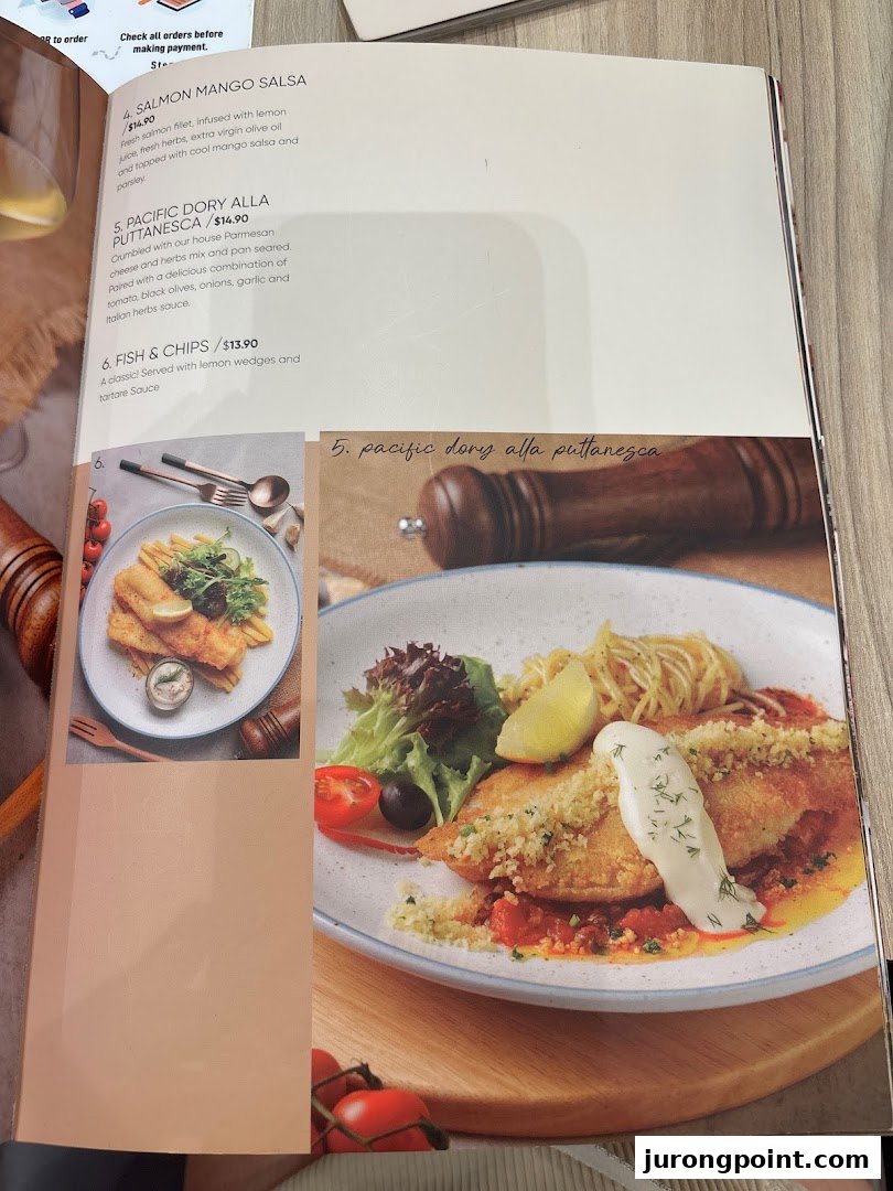 A page from the Hot Tomato menu featuring seafood dishes with descriptions and prices.