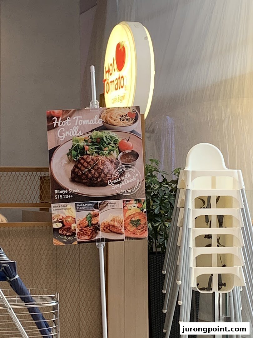 A menu board for Hot Tomato Grills featuring steak and other grilled dishes with prices.