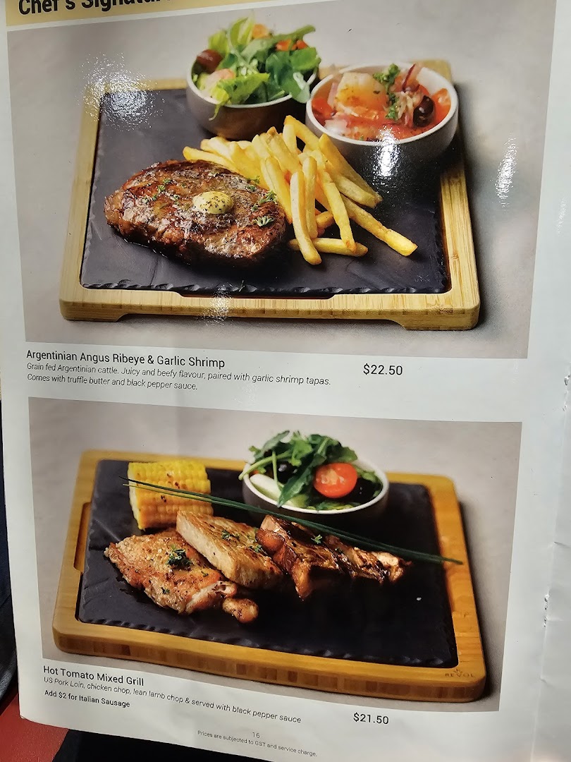 A menu page showcasing delicious Argentinian Angus Ribeye and Hot Tomato Mixed Grill dishes with prices.