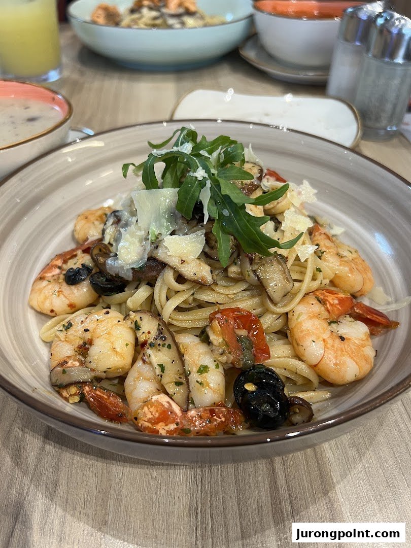 A close-up of a delicious pasta dish with shrimp, mushrooms, and arugula.