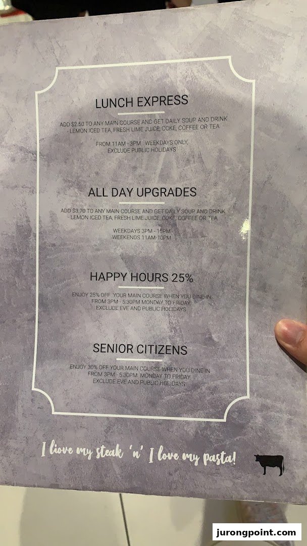 A close-up image of Hot Tomato's menu, detailing lunch specials, upgrades, and discounts.