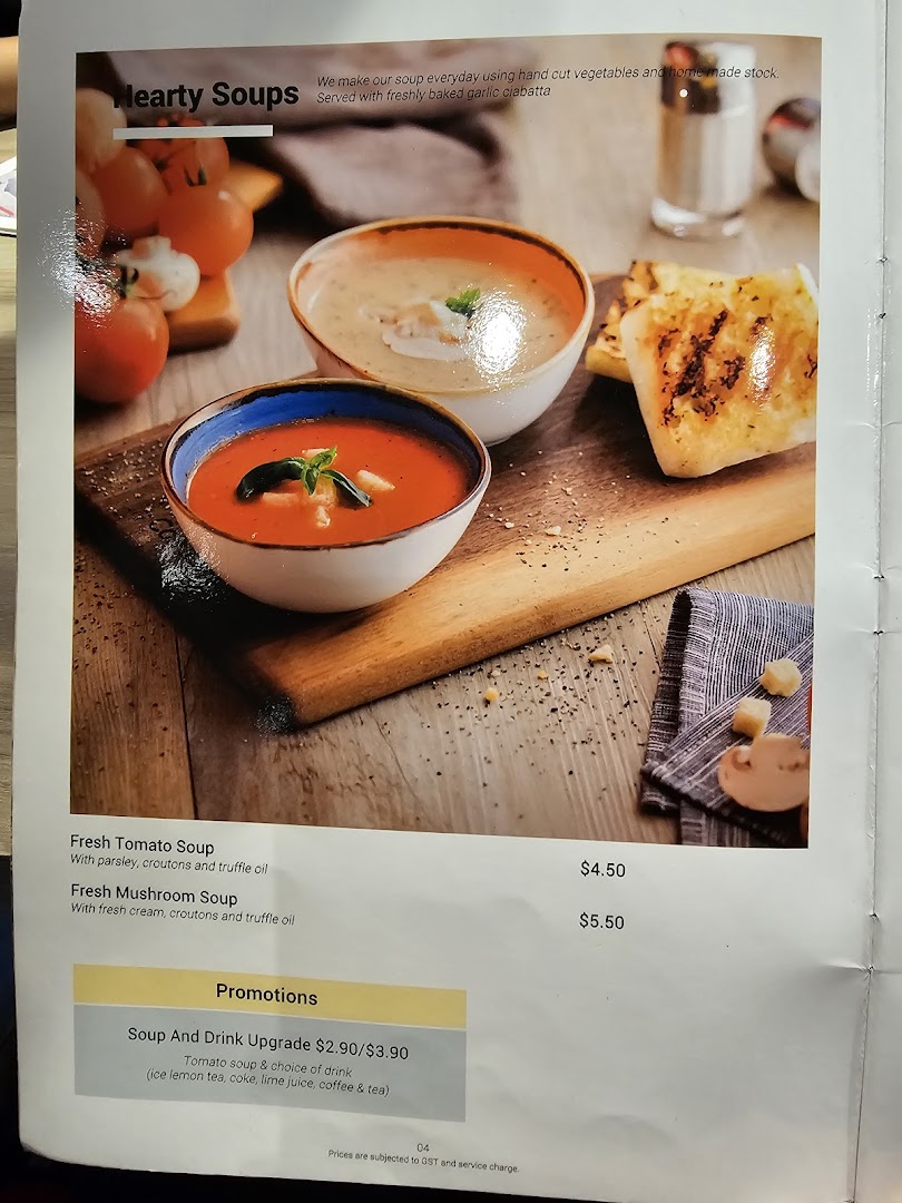 A menu page showcasing hearty soups with garlic ciabatta, prices, and promotions from Hot Tomato.