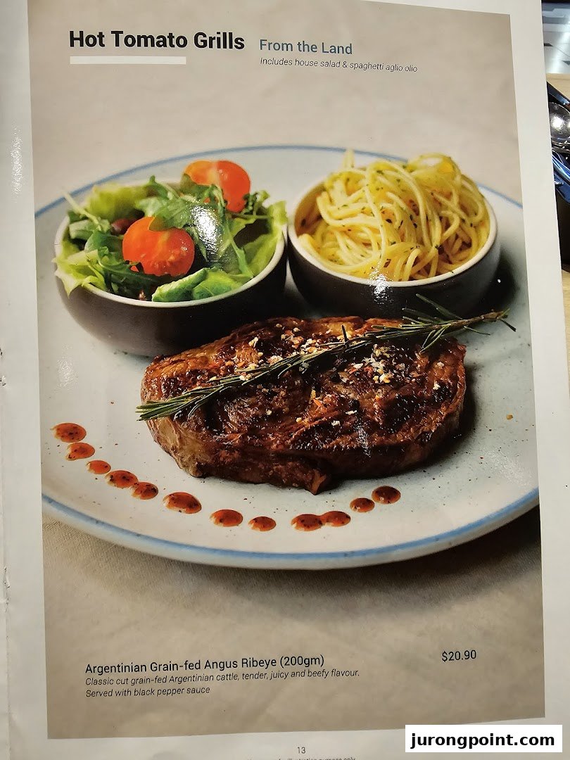 A menu page showcasing a grilled Argentinian Angus Ribeye steak with salad and spaghetti.