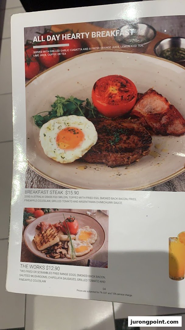 A menu page from Hot Tomato showcasing hearty breakfast options with detailed descriptions and prices.