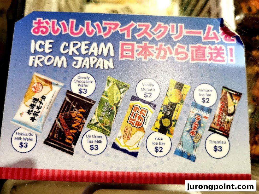 A display board showcasing various Japanese ice cream products with their names and prices.