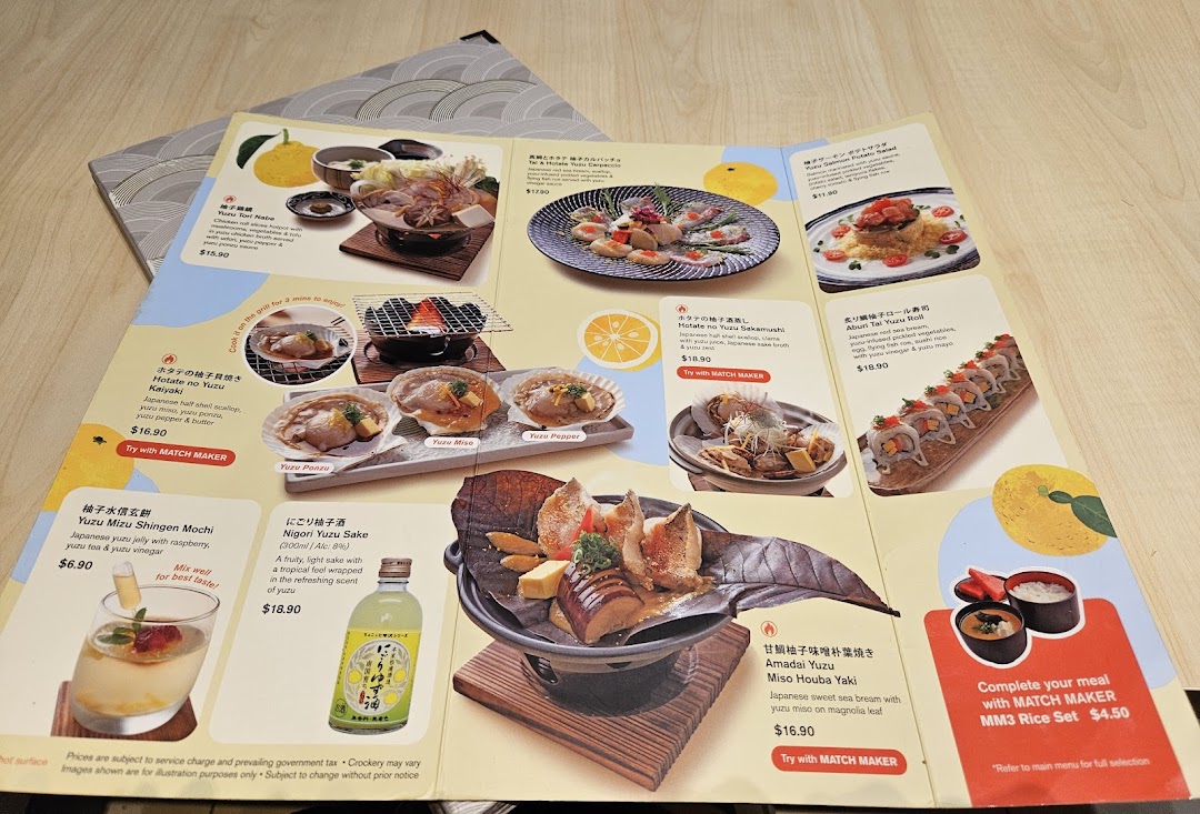 A vibrant menu from Ichiban Boshi showcasing a variety of yuzu-infused Japanese dishes and beverages.