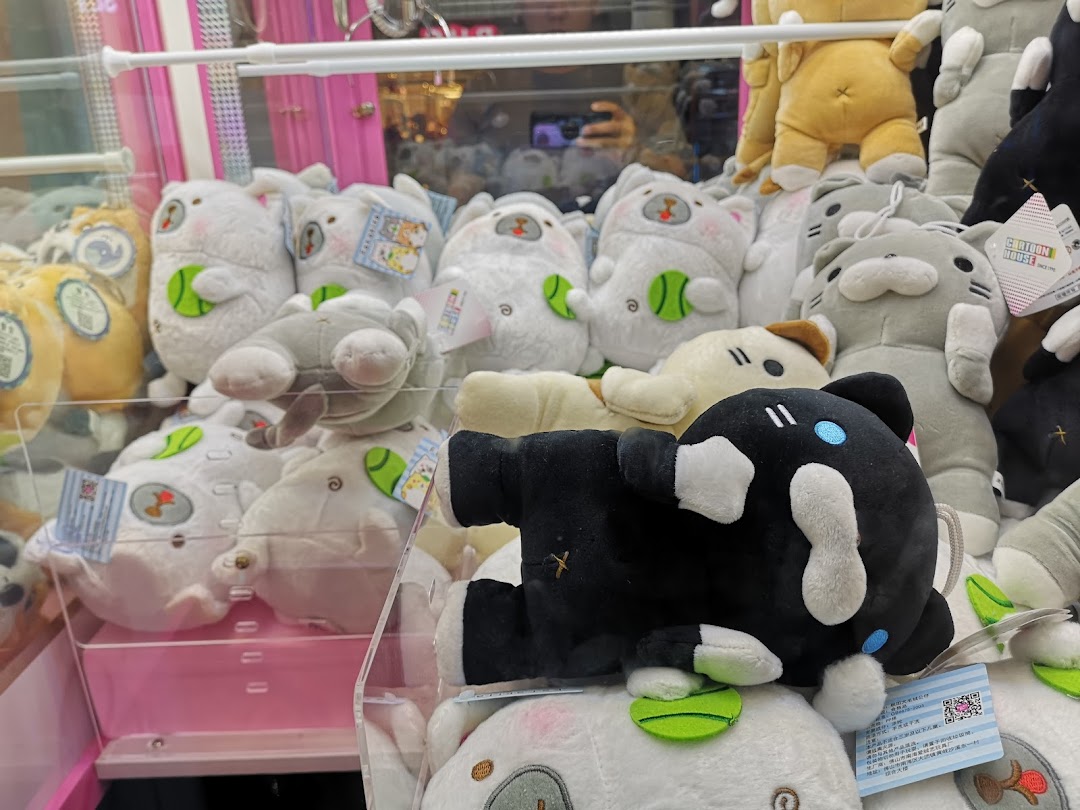 A vibrant claw machine filled with an assortment of cute plush toys, ready for players to win.